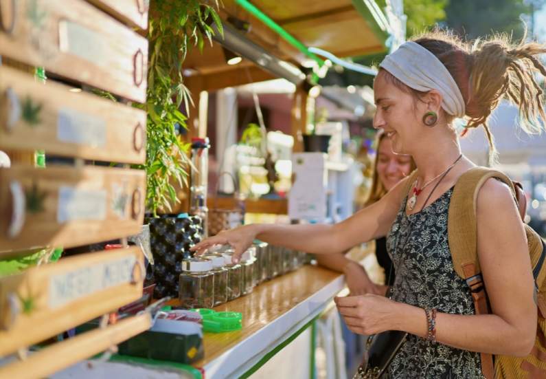 Young lady shopping for the right cannabis strain to consume.