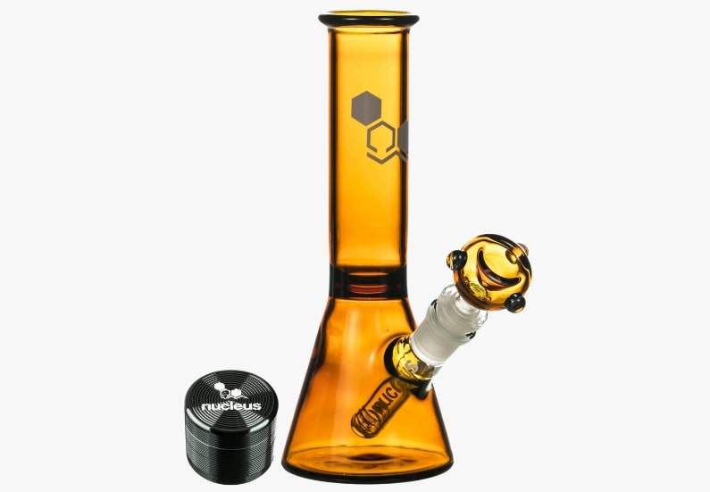 Nucleus Basics 8" Beaker Bong paired with a 4-piece grinder, featuring a compact glass design and beaker base.